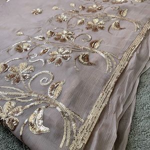 Dusky pink, pure chiffon, embroidered saree with chiffon blouse. Unstitched.